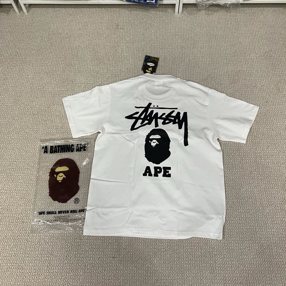 Stussy White Short Sleeve Tee with Black Graphic